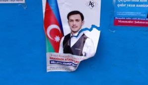 Daha bir deputatlığa namizədin şəkillərini cırdılar -         FOTOLAR — foto 1